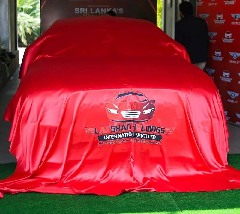 Bentley covered in red fabric before its unveiling
